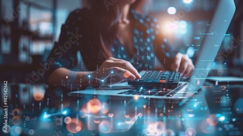 Woman working on laptop with digital data overlay