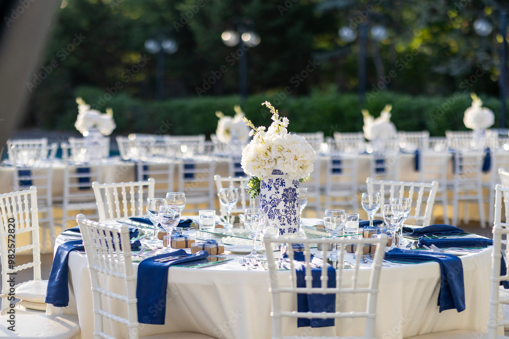 Elegant Outdoor Wedding Reception Table with Blue and White Theme