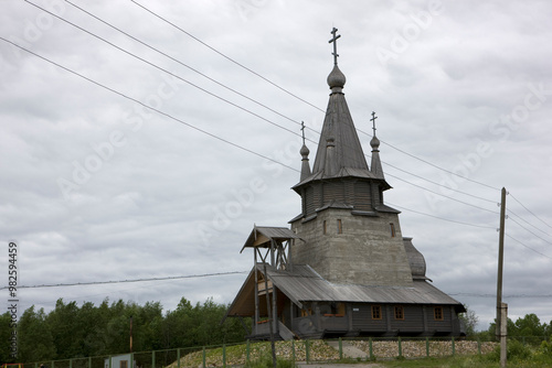 Russia Karelia Povenets Church of St. Nicholas the Wonderworker on a cloudy summer day photo