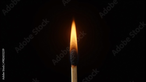 a match is burning against a black background.