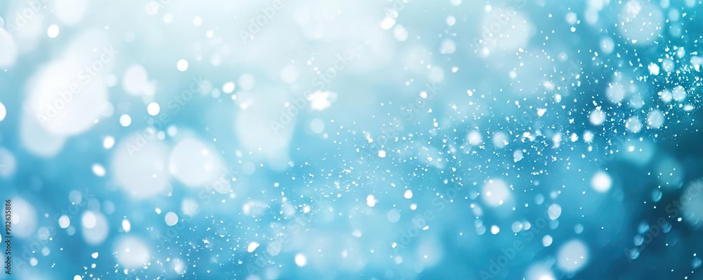 A stunning abstract background featuring light bokeh effects in shades of blue, perfect for artistic projects and designs. A stunning abstract background featuring light bokeh effects in shades of blue, perfect for artistic projects and designs.