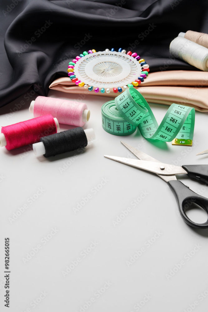 Crafting essentials for sewing projects displayed on a table with fabric, threads, and tools Crafting essentials for sewing projects displayed on a table with fabric, threads, and tools
