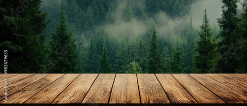 A rustic wooden table against a misty forest backdrop, perfect for showcasing nature-themed products or serene landscapes.
