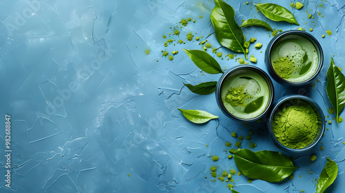 Matcha Tea Powder and Fresh Green Leaves on Blue Background
