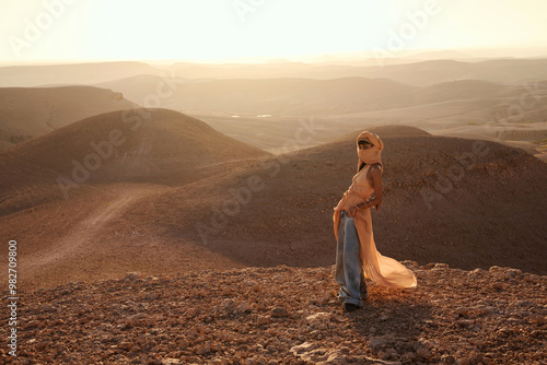 Fashion shooting in the desert, professional model and stylish Muslim clothing.