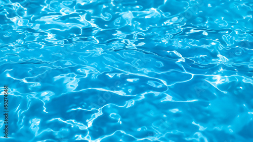 Bright Blue Water Surface Texture in Swimming Pool with Sunlight Reflections