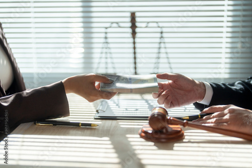 Businesswoman bribing judge with money in courtroom