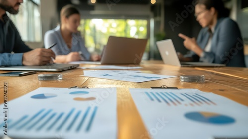 Group discussing financial reports around a conference table