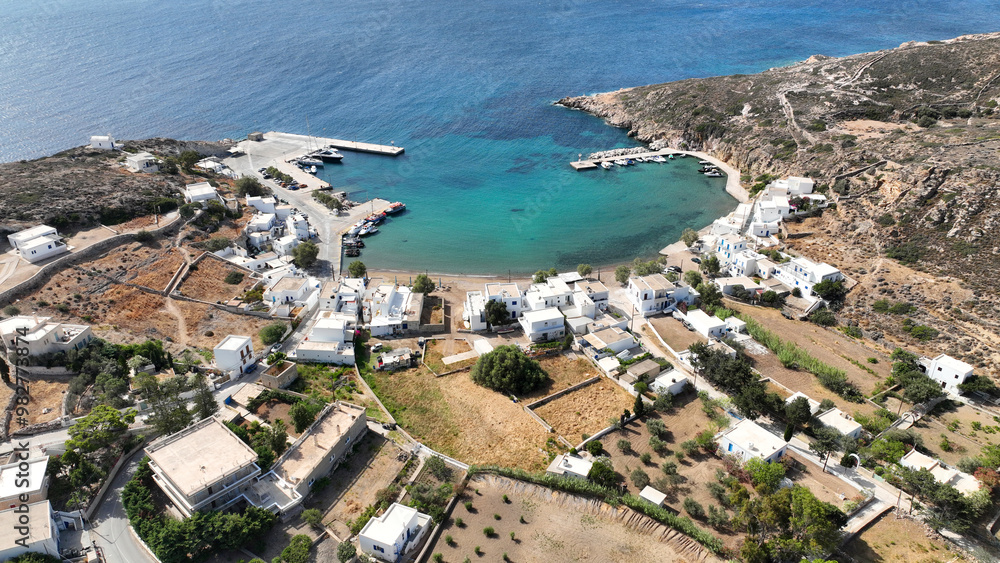 Fototapeta premium Aerial drone photo small port of Psathi untouched by tourism built below picturesque hora of Kimolos island, Cyclades, Greece