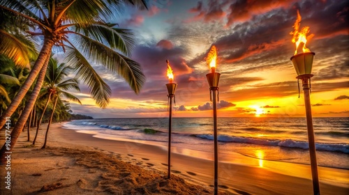 Tropical beach at sunset with three lit torches and palm trees lining the shore The waves gently lap the sand as the sky explodes in shades of orange yellow and red creating a serene scene. photo