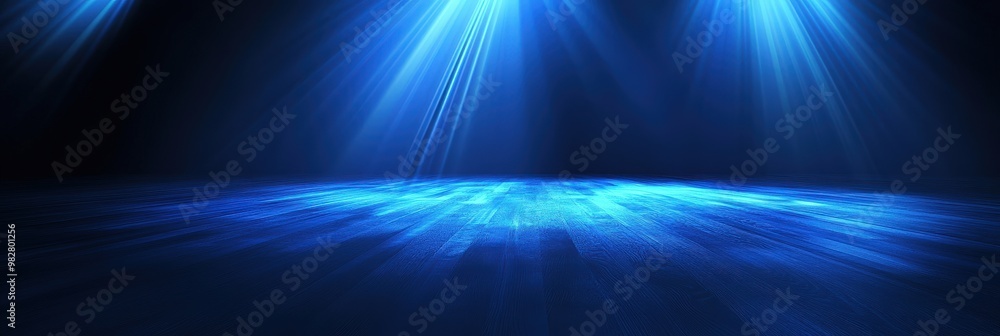 Dramatic Blue Light Rays on Dark Floor Background Dramatic Blue Light Rays on Dark Floor Background