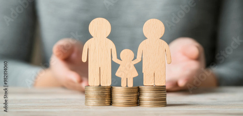 Family figures on coins symbolize financial security and support photo