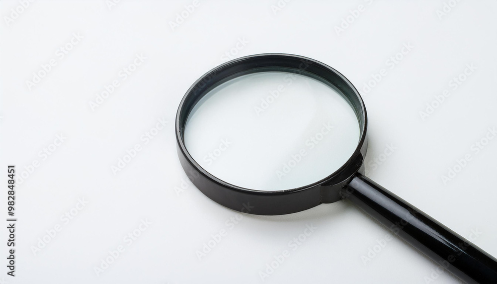 Magnifying glass on white background. Flat lay. Top view. Close-up. Magnifying glass on white background. Flat lay. Top view. Close-up.