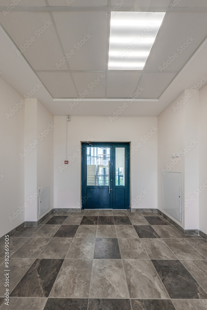 long empty corridor in interior of entrance hall of modern apartments, office or clinic long empty corridor in interior of entrance hall of modern apartments, office or clinic