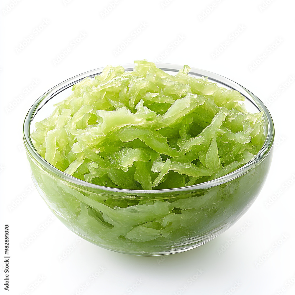 Fresh green papaya slices are beautifully arranged in clear glass bowl, showcasing their vibrant color and texture. This image captures essence of healthy eating and tropical flavors Fresh green papaya slices are beautifully arranged in clear glass bowl, showcasing their vibrant color and texture. This image captures essence of healthy eating and tropical flavors