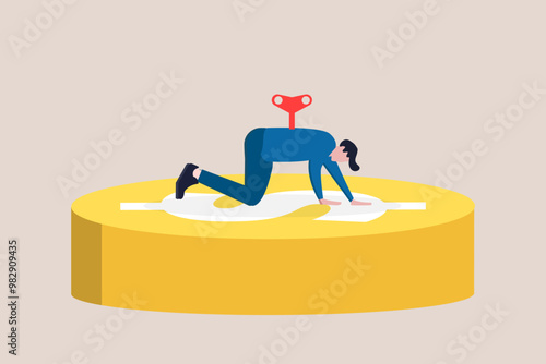 Businessman with shaped wind up key on money  sign. under control, stress, target, struggling with credit card debt and expenses
