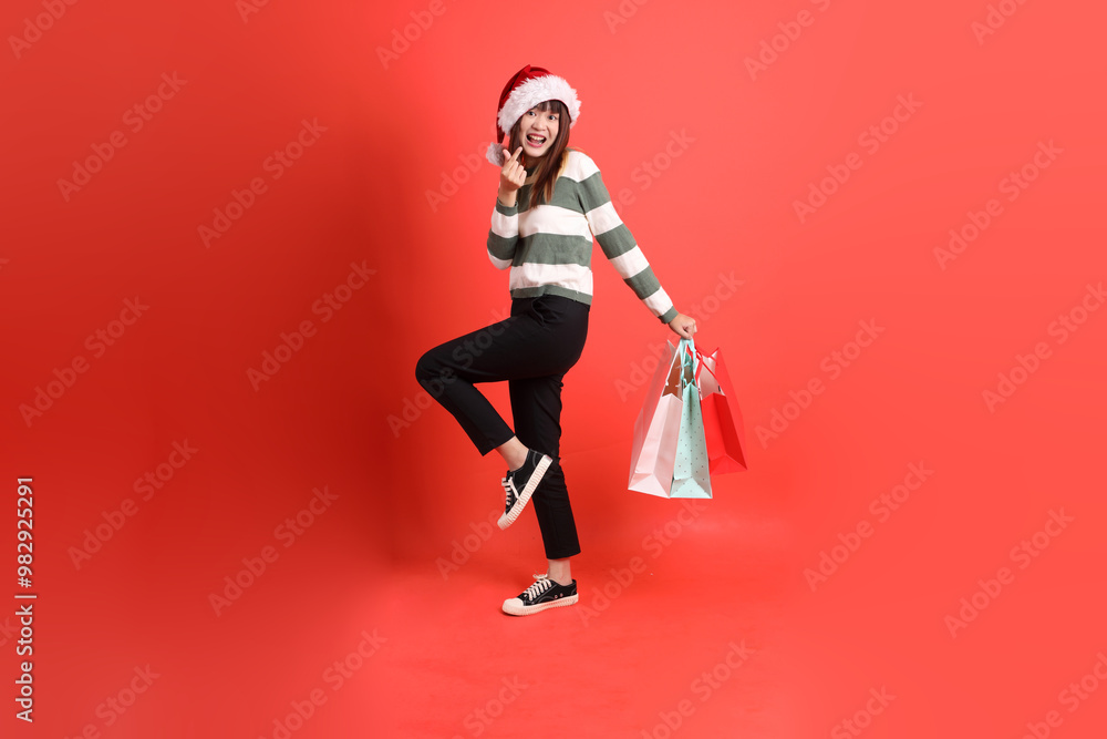 Woman wearing Santa hat Woman wearing Santa hat