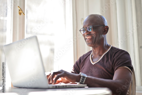 adult man works in a computer at home