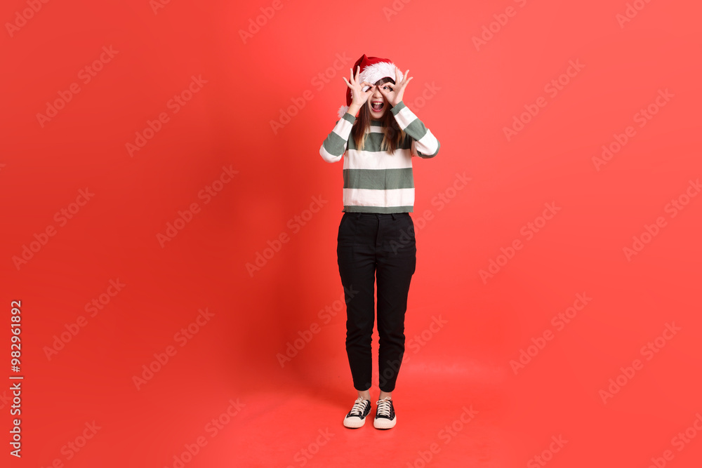 Woman wearing Santa hat Woman wearing Santa hat