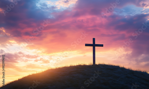 A cross on the hill with a sunset sky background, an Easter concept