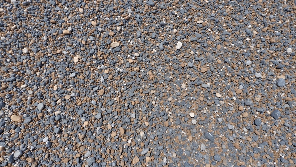 Rough gravel texture with small gray and brown stones for outdoor or industrial use Rough gravel texture with small gray and brown stones for outdoor or industrial use