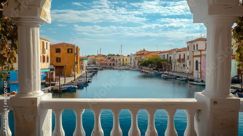 A white balustrade frames a view of the Vitoria canal from a Greek restaurant. photo