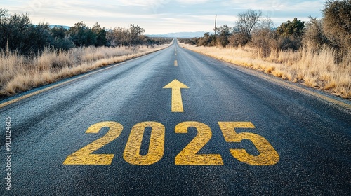  A long, empty asphalt road leads into the distance, with the yellow numbers 