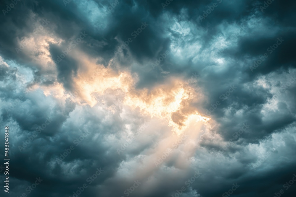 Fototapeta premium Enigmatic gloomy skies teeming with threatening clouds prior to rainfall as creative canvas, intense climate, rays of sun piercing the shadows, striking contrast visuals