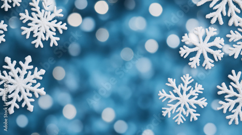 Snowflakes on a blurred blue background, winter decoration theme photo