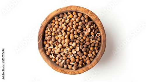 Wooden bowl filled with assorted nuts on a white background. Top down aerial view of various nut in wooden bowl with white background. Food photograph. Healthy snack and nutrition concept. AIG51.