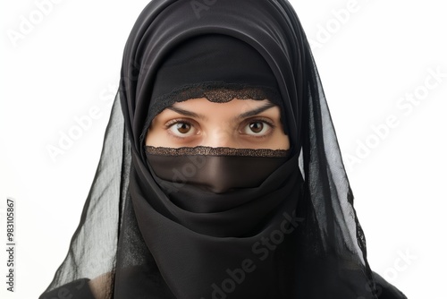 A Muslim lady posing gracefully with captivating eyes and a traditional niqab, embodying faith and beauty.