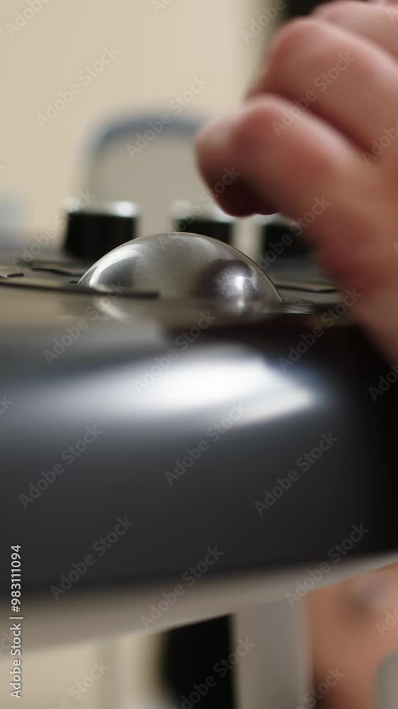 In this vertical video, a close-up captures a doctor performing an ultrasound in a modern diagnostic center. The setup and operation of advanced ultrasound equipment highlight the commitment In this vertical video, a close-up captures a doctor performing an ultrasound in a modern diagnostic center. The setup and operation of advanced ultrasound equipment highlight the commitment