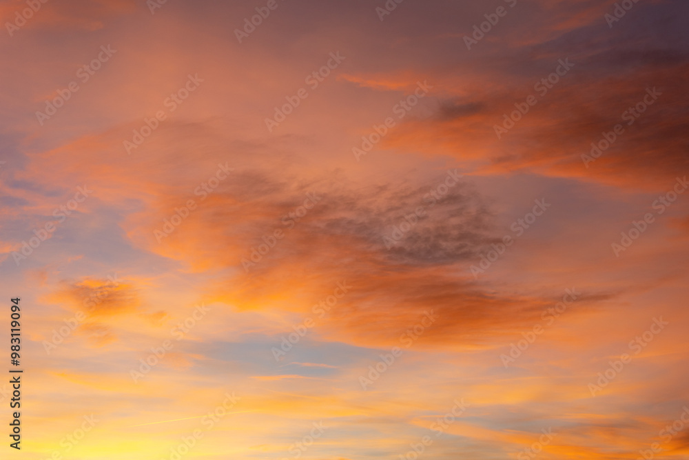 Colorful clouds fill the sky during sunset, creating a vibrant and serene scene. The changing colors and soft light make a beautiful background Colorful clouds fill the sky during sunset, creating a vibrant and serene scene. The changing colors and soft light make a beautiful background