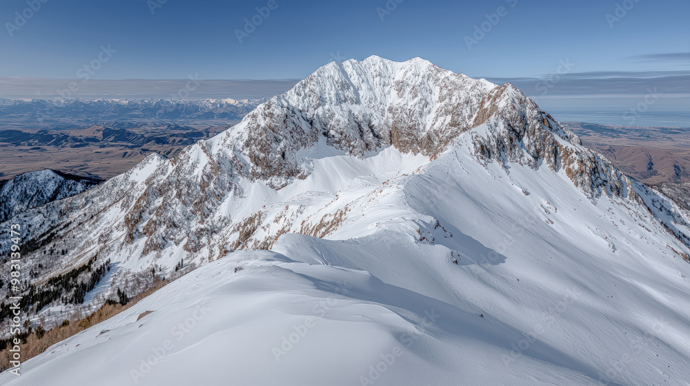 Fototapeta premium Majestic Winter Mountain Peaks A Stunning Snow-Covered Landscape, Showcasing the Beauty of Nature's Towering Giants A Serene View of Snow-Capped Summits in Winter's Embrace