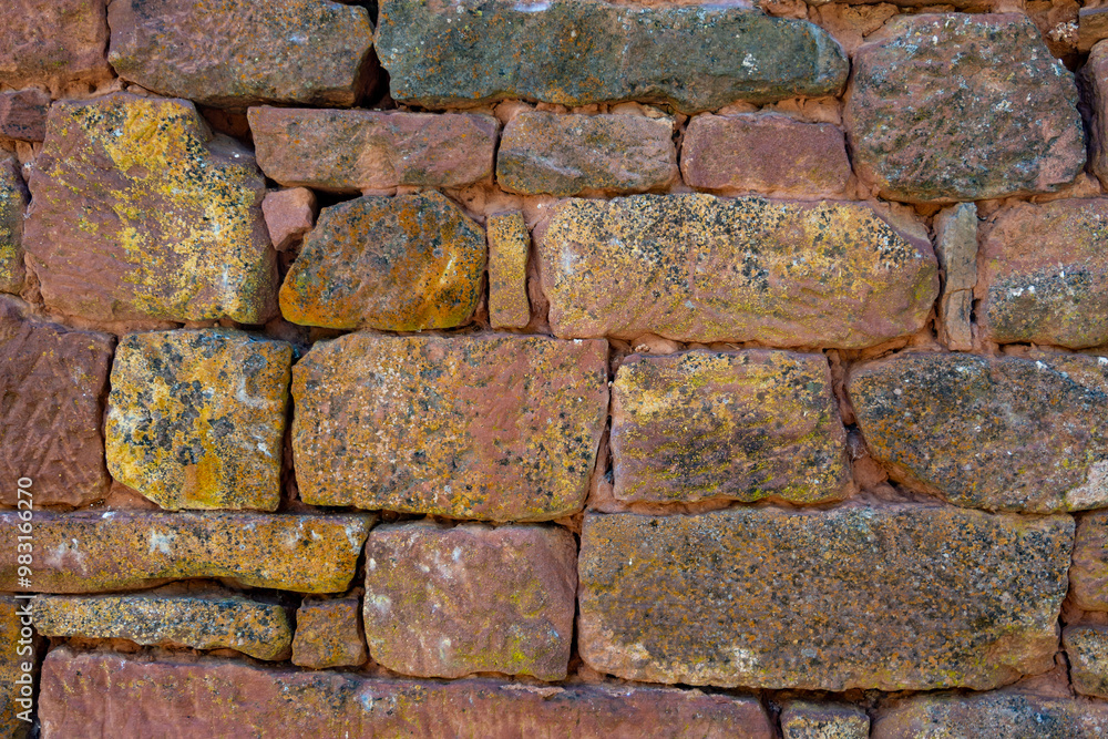 Brick background in Collonges-la-Rouge village, one of the most beautiful villages in France with houses made from red stones, tourists destination in Dordogne Brick background in Collonges-la-Rouge village, one of the most beautiful villages in France with houses made from red stones, tourists destination in Dordogne
