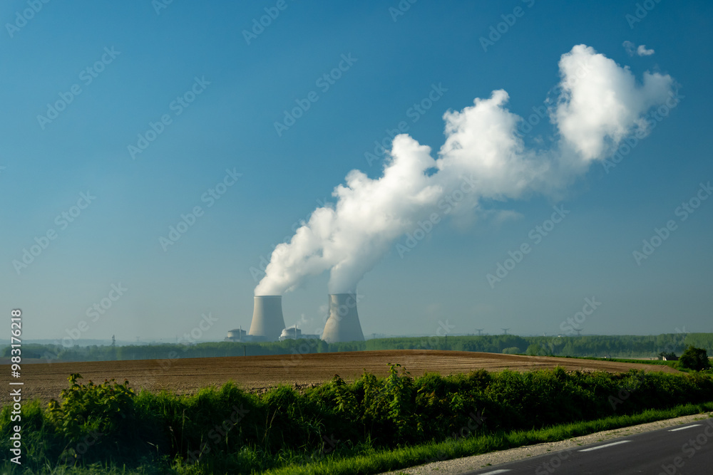 View on cooling towers of nuclear power plant thermal power station in which heat source is nuclear reactor, France, Europe View on cooling towers of nuclear power plant thermal power station in which heat source is nuclear reactor, France, Europe