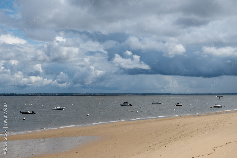 Walking on beach promenade in Arcachon, vacation destination town on Atlantic coast with beatiful parks, villas, streets and sandy beach, France Walking on beach promenade in Arcachon, vacation destination town on Atlantic coast with beatiful parks, villas, streets and sandy beach, France