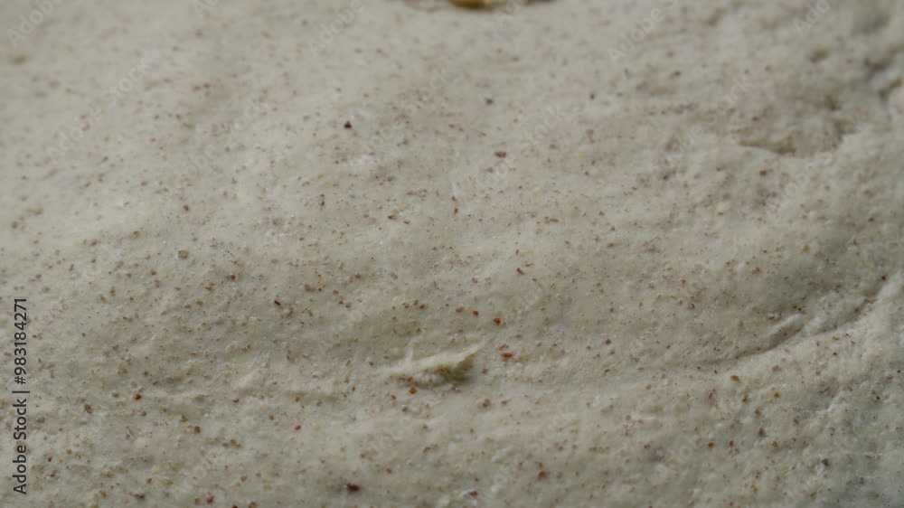 a baker punching bread dough to release leavening gases, bread making process a baker punching bread dough to release leavening gases, bread making process