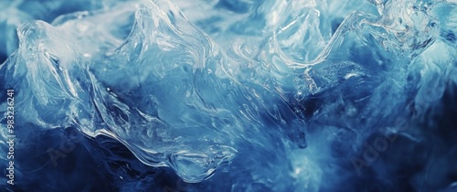 Waves crashing and swirling in deep blue water at twilight near a rocky shore...
