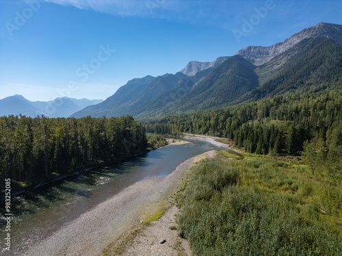 Scenic View of River and Mountains in Fernie, BC, Canada on a Clear Day