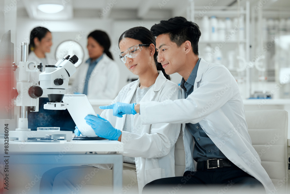 Research team, tablet and science in lab for healthcare, medicine development and innovation. Scientist, people or technology at microscope for analysis, investigation or planning engineering process Research team, tablet and science in lab for healthcare, medicine development and innovation. Scientist, people or technology at microscope for analysis, investigation or planning engineering process
