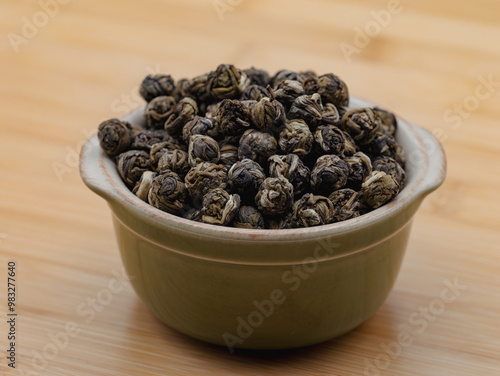 Bowl with round jasmine tea  photo