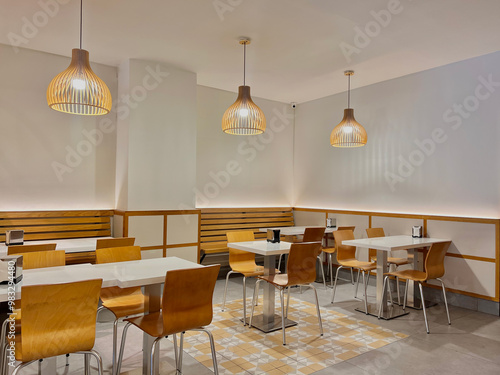 Background image of empty food court interior with wooden tables and warm cozy light setting photo