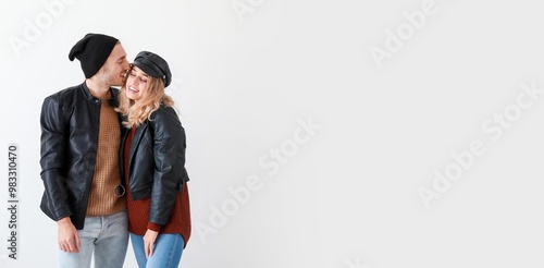 Happy young couple in warm ...