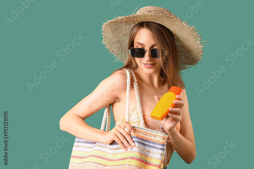 Young woman with sunscreen ...