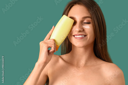 Young woman with sunscreen ...