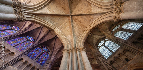 stained glass windows and ceiling of famous cathedral in french city of reims photo