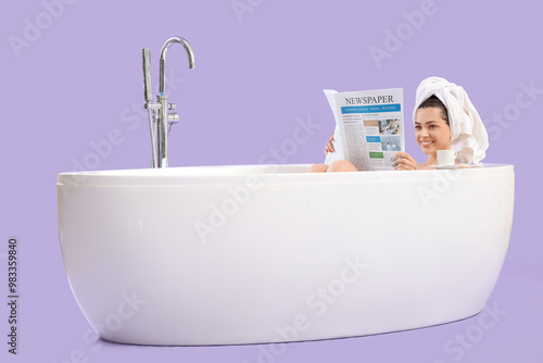 Young woman with newspaper ...