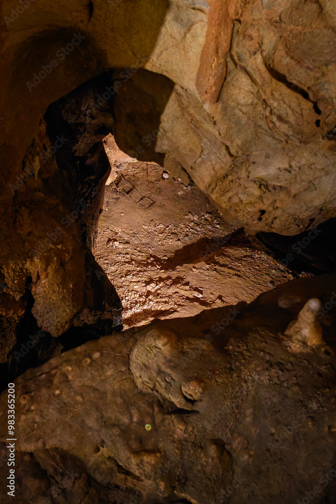 An old ladder lying at the bottom of a cave.
An old ladder lying at the bottom of a cave.