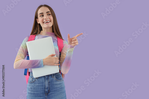Happy female student with b...